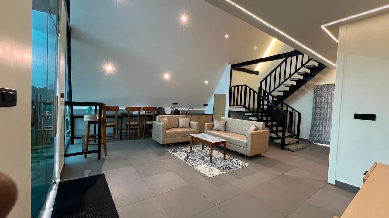 Dining, lounge and the stair to the loft